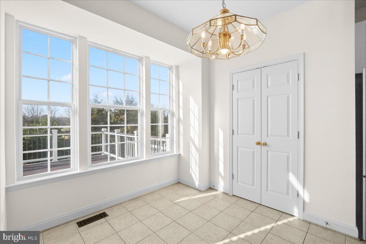 927 Buttonwood Terrace Northeast Leesburg, VA 20176 - Photo 18 of 44 a view of an empty room with a window