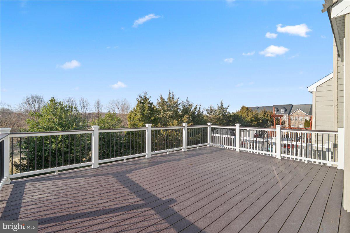 927 Buttonwood Terrace Northeast Leesburg, VA 20176 - Photo 19 of 44 a view of a balcony with wooden floor