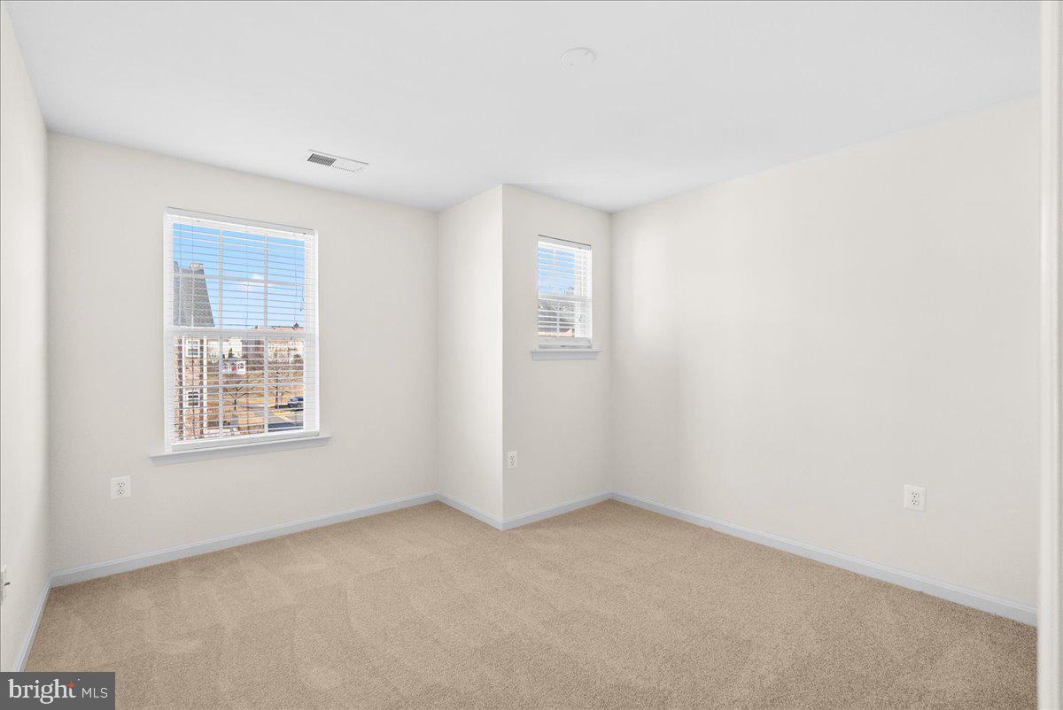 927 Buttonwood Terrace Northeast Leesburg, VA 20176 - Photo 25 of 44 an empty room with windows