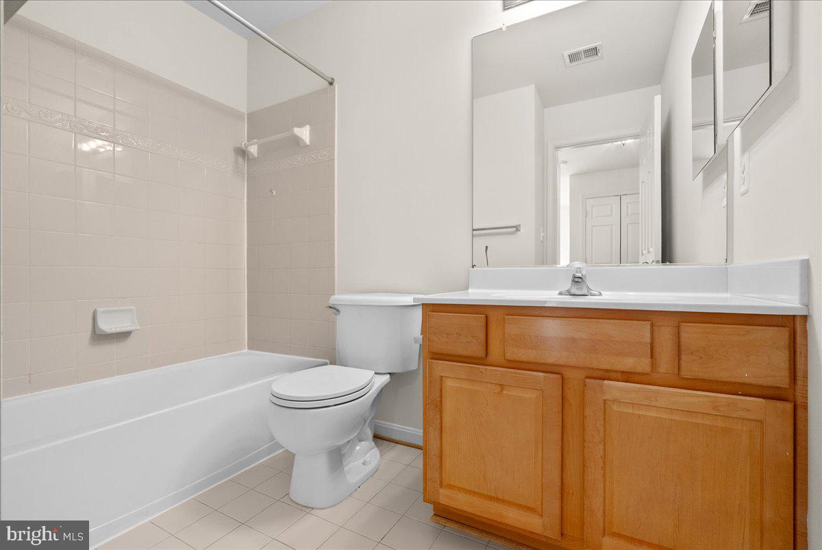 927 Buttonwood Terrace Northeast Leesburg, VA 20176 - Photo 27 of 44 a bathroom with a sink a toilet and shower