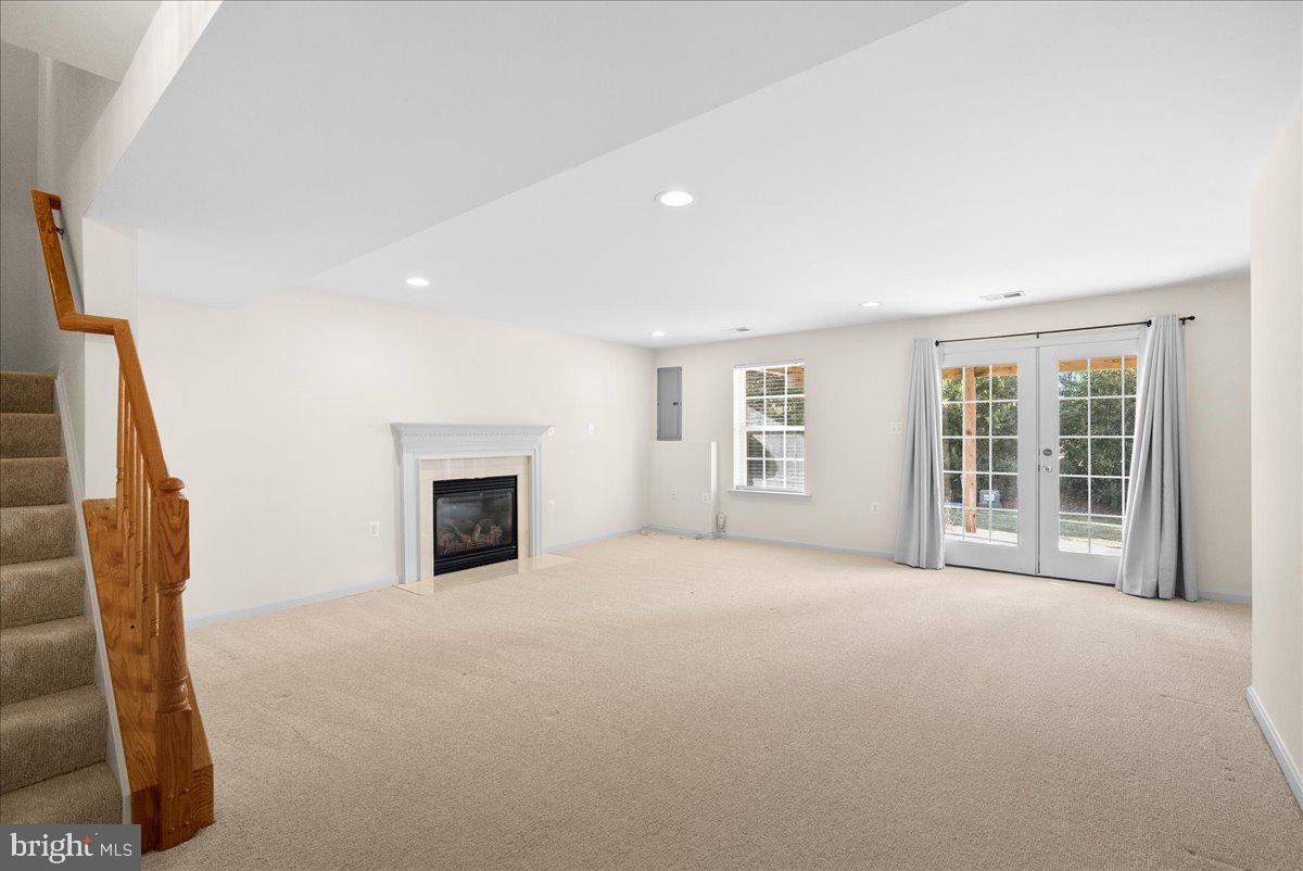 927 Buttonwood Terrace Northeast Leesburg, VA 20176 - Photo 36 of 44 a view of a livingroom with an empty space and a fireplace