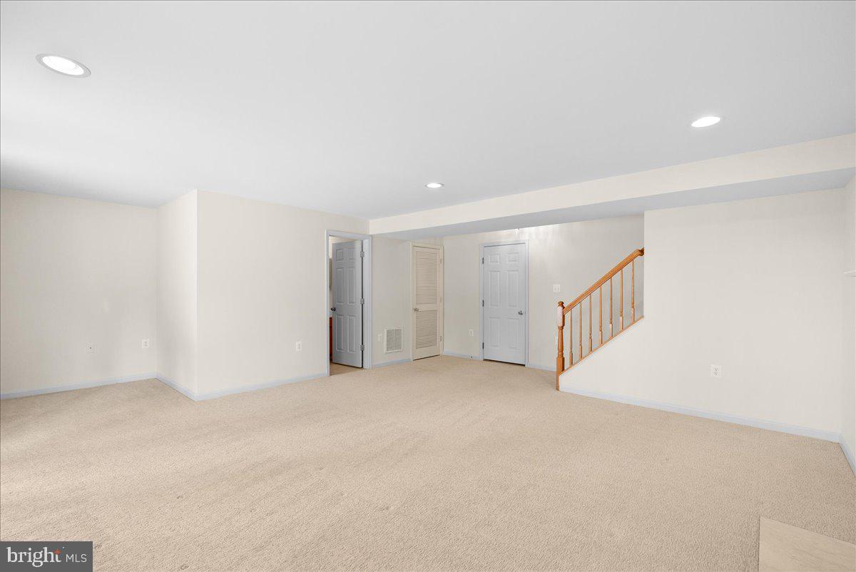 927 Buttonwood Terrace Northeast Leesburg, VA 20176 - Photo 37 of 44 an empty room with an entryway