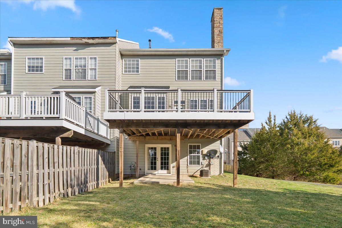 927 Buttonwood Terrace Northeast Leesburg, VA 20176 - Photo 39 of 44 a front view of a house with a yard