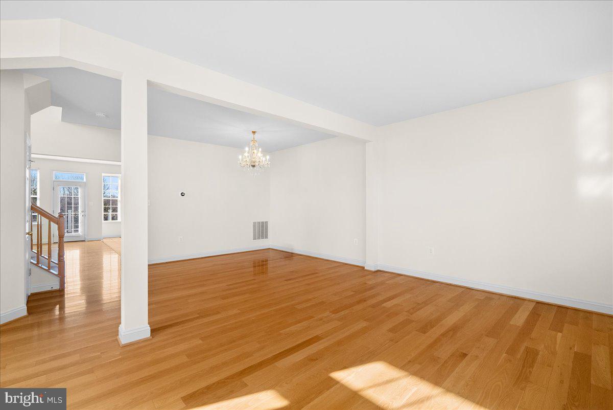 927 Buttonwood Terrace Northeast Leesburg, VA 20176 - Photo 5 of 44 a view of empty room with wooden floor