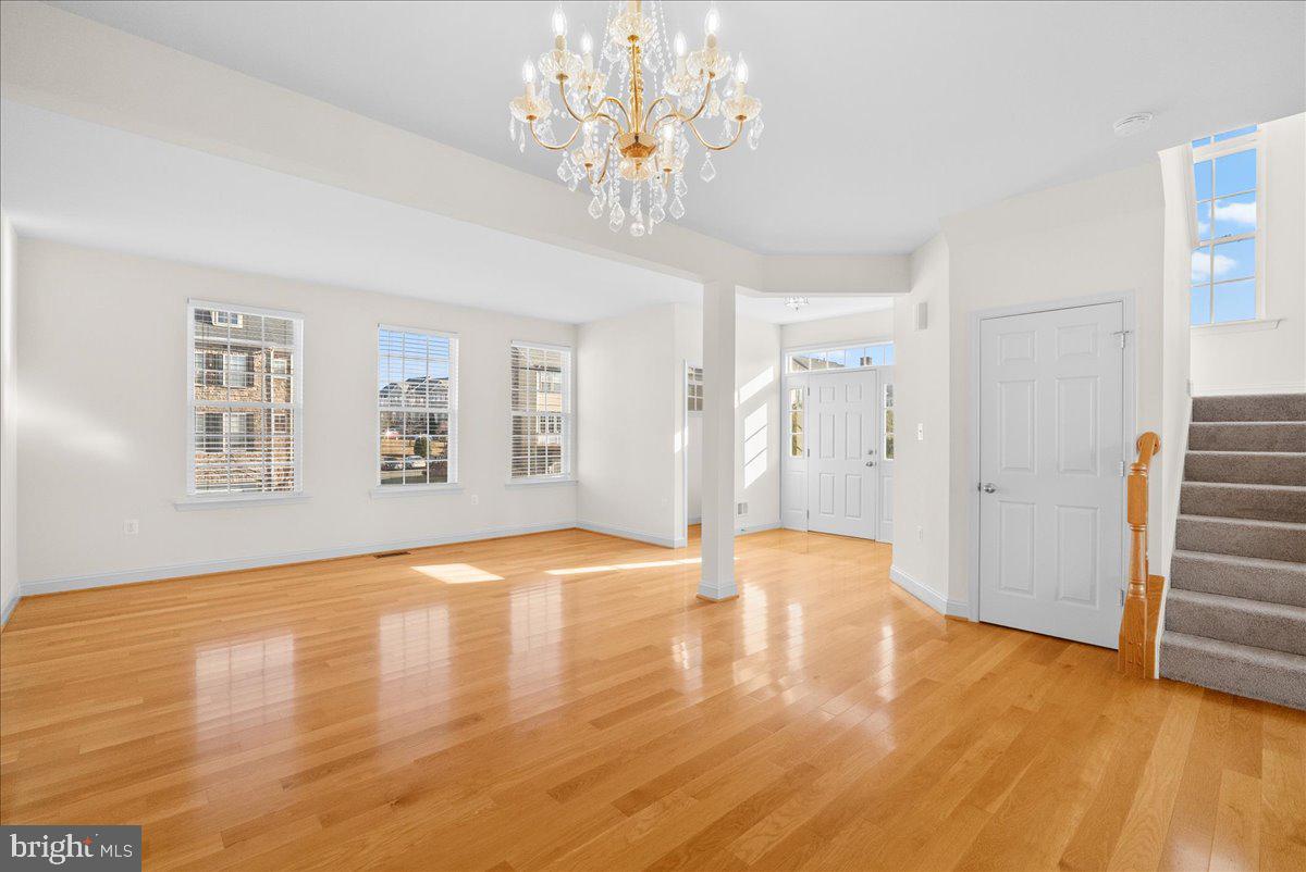 927 Buttonwood Terrace Northeast Leesburg, VA 20176 - Photo 6 of 44 a view of empty room with wooden floor and window