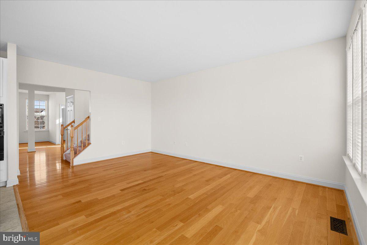 927 Buttonwood Terrace Northeast Leesburg, VA 20176 - Photo 10 of 44 a view of empty room with wooden floor