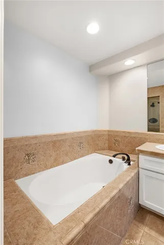 a bathroom with a bathtub and shower