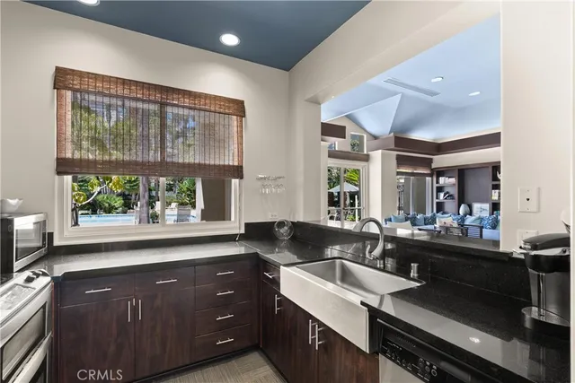 a kitchen with a stove a sink and a refrigerator