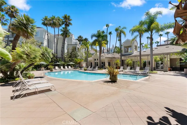 a view of a building with palm trees