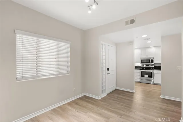 a view of kitchen with wooden floor