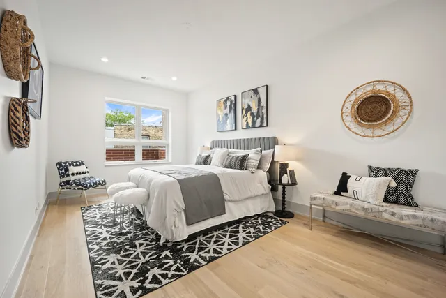 a bedroom with a bed and a couch