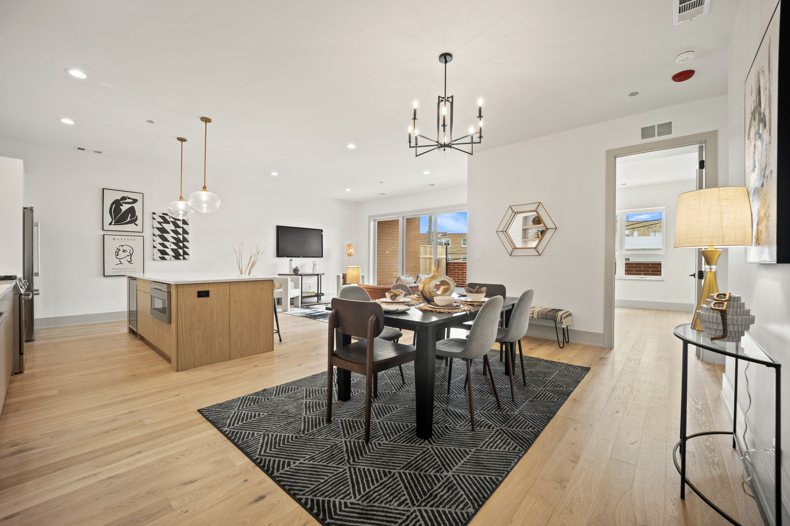 1548 West Ardmore Avenue, Unit 3B Chicago, IL 60660 - Photo 2 of 32 a view of a dining room and livingroom with furniture wooden floor a chandelier