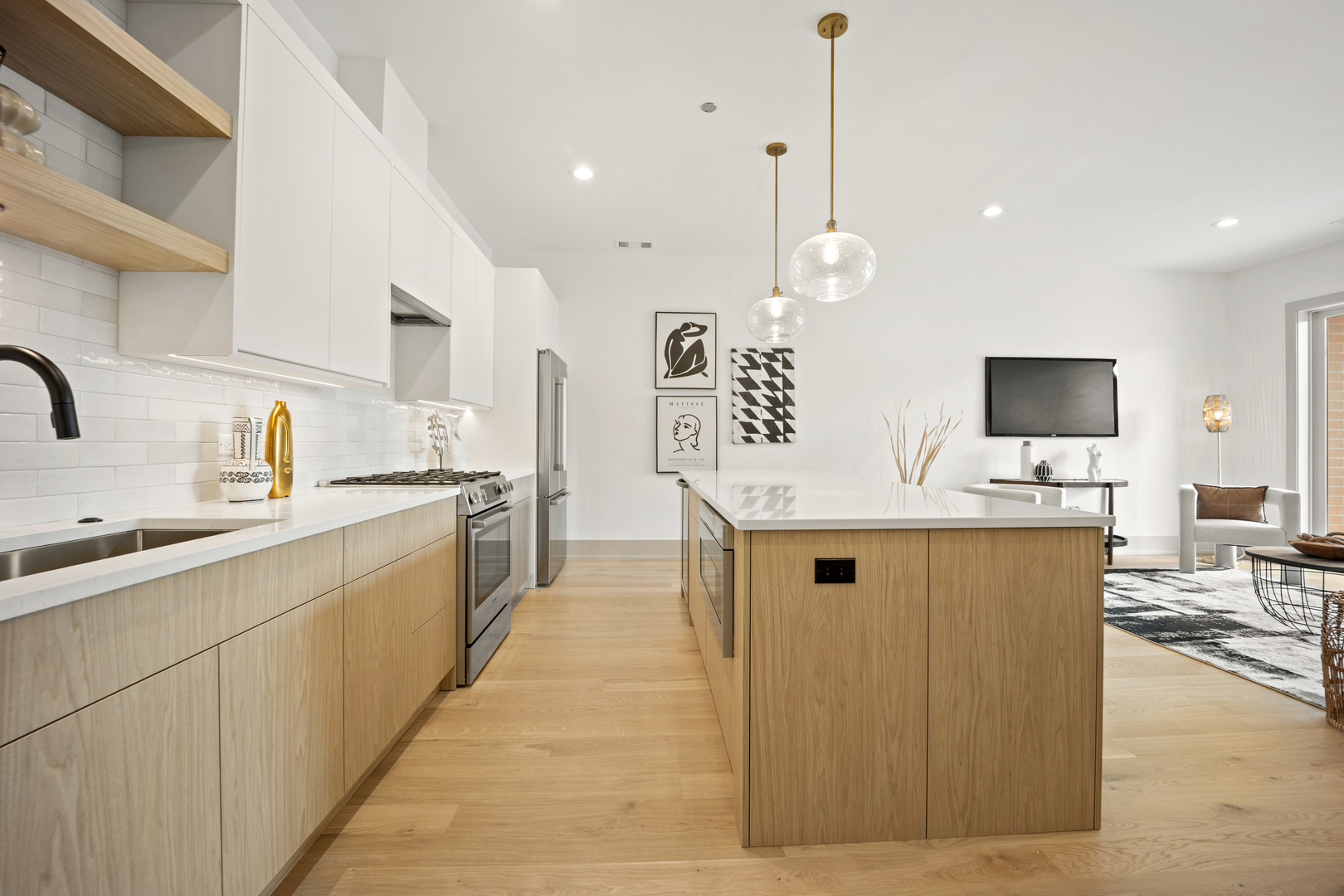 1548 West Ardmore Avenue, Unit 3B Chicago, IL 60660 - Photo 6 of 32 a kitchen with stainless steel appliances kitchen island granite countertop a sink a stove and cabinets