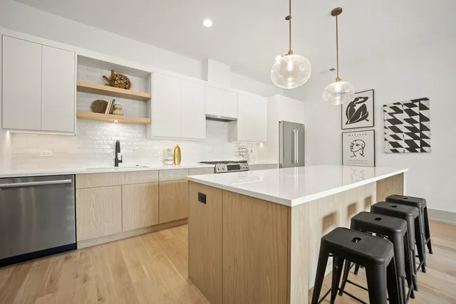 a kitchen with a table and chairs in it