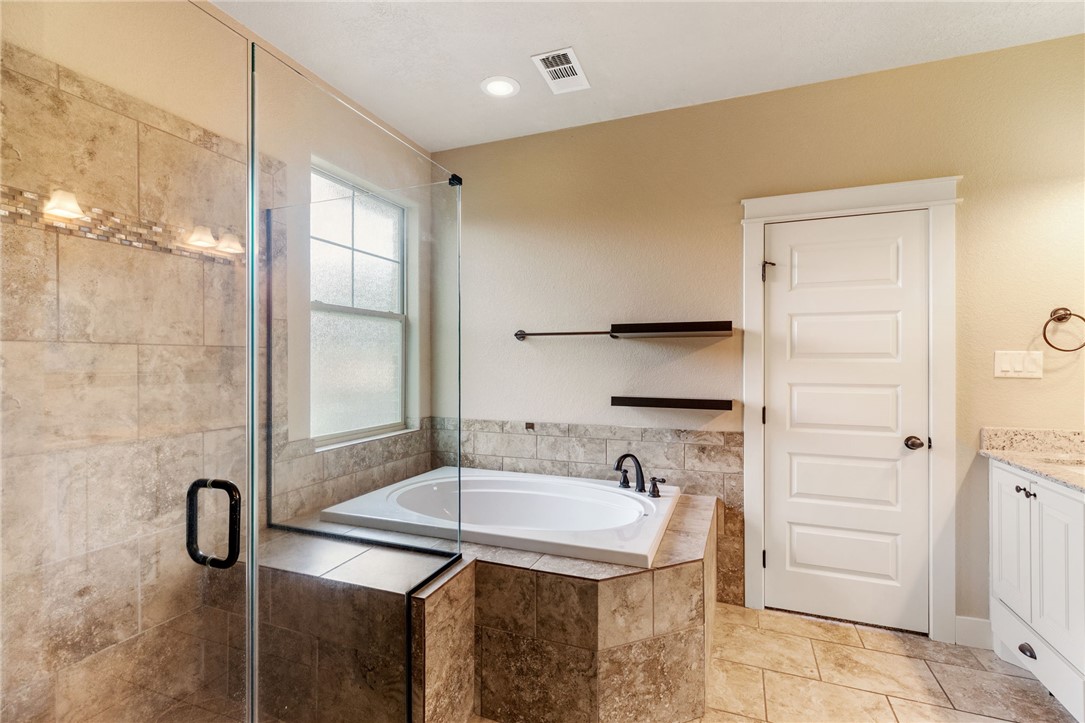 2136 Rockcliffe Loop College Station, TX 77845 - Photo 31 of 48 a bathroom with a sink and a mirror