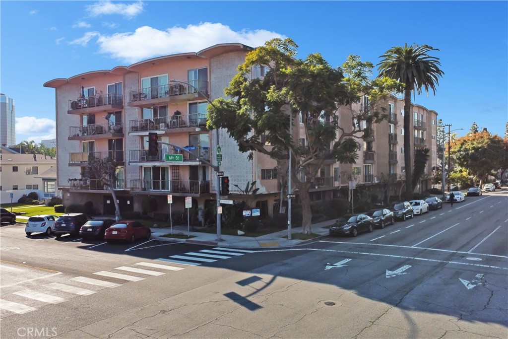 545 Chestnut Avenue, Unit 406 Long Beach, CA 90802 - Photo 2 of 16 a car parked in front of a building