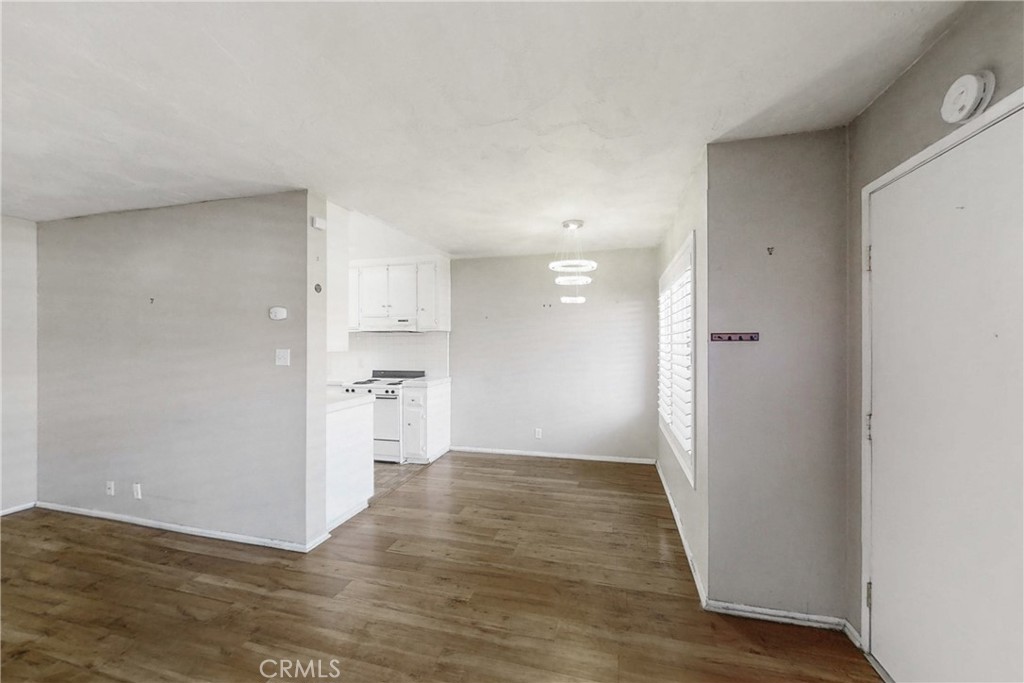 545 Chestnut Avenue, Unit 406 Long Beach, CA 90802 - Photo 5 of 16 a view of a kitchen and a refrigerator