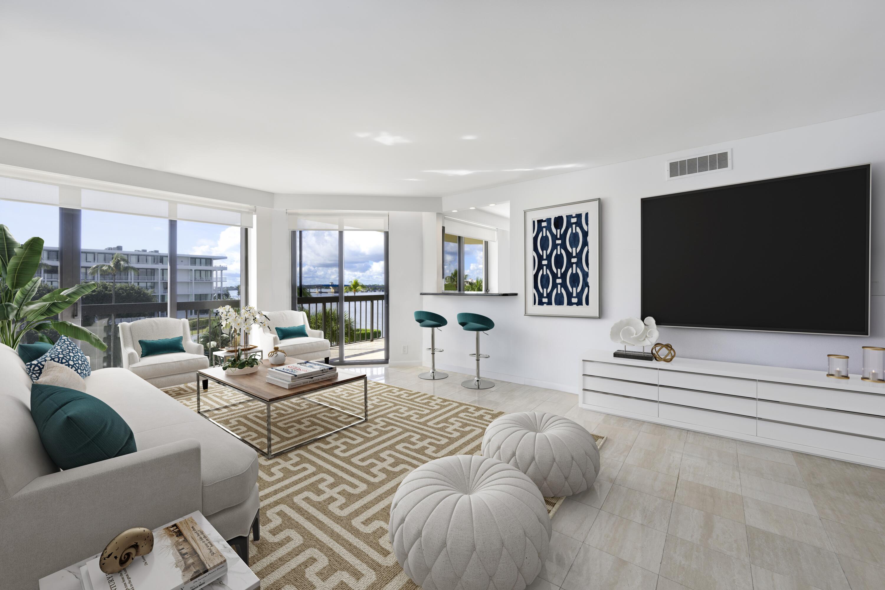 2778 South Ocean Boulevard, Unit 303N Palm Beach, FL 33480 - Photo 1 of 21 a living room with furniture and a flat screen tv