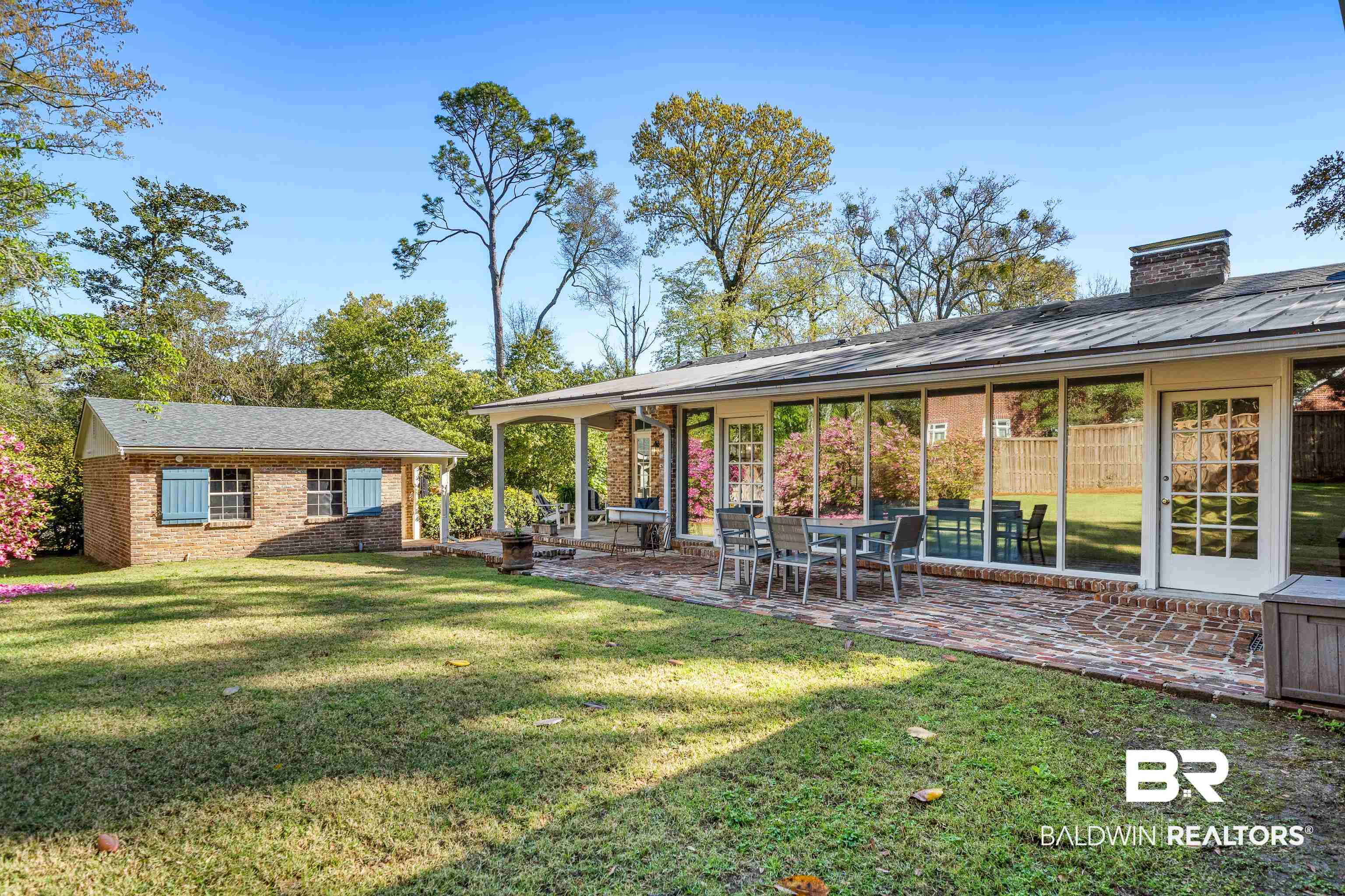 141 Myrtlewood Lane Mobile, AL 36608 - Photo 36 of 44 Rear view of property with a lawn, a chimney, a patio, and brick siding