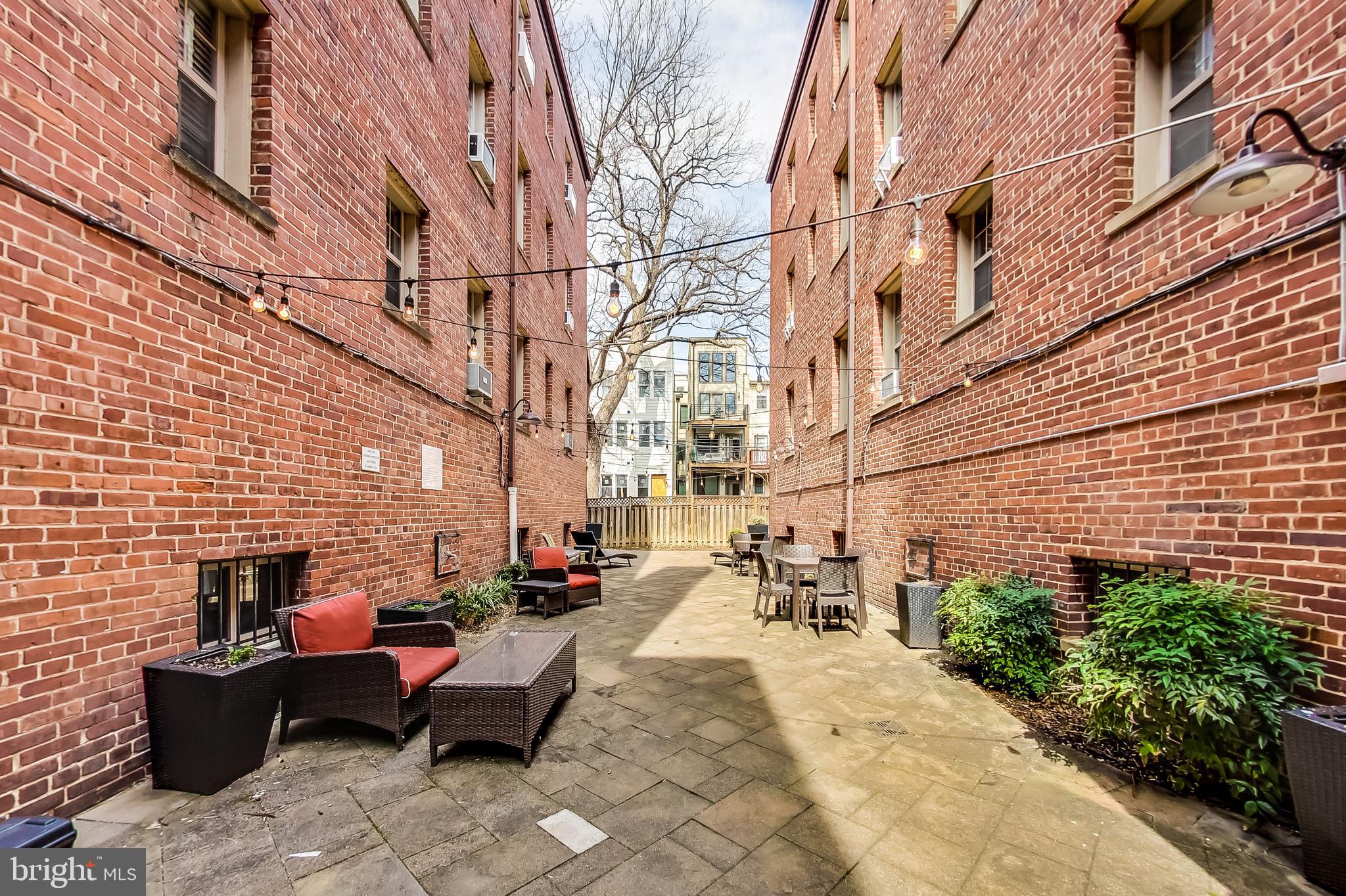 1441 Euclid Street Northwest, Unit 105 Washington, DC 20009 - Photo 14 of 20 a building outdoor space with patio furniture
