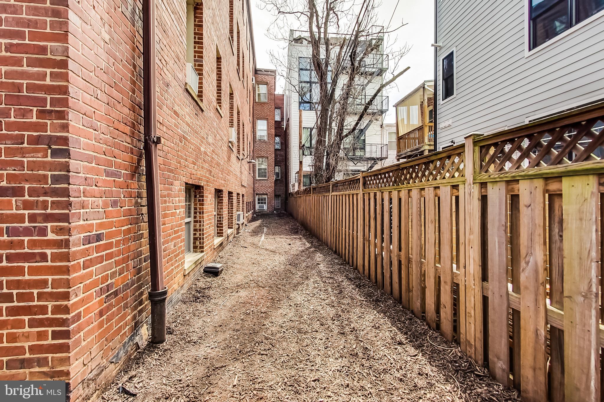 1441 Euclid Street Northwest, Unit 105 Washington, DC 20009 - Photo 18 of 20 a view of a pathway with a house