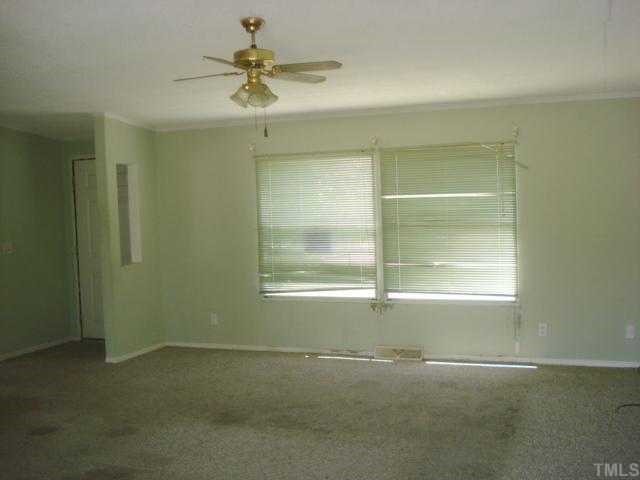 1001 Barnes Road Middlesex, NC 27557 - Photo 5 of 12 an empty room with a window and a fan