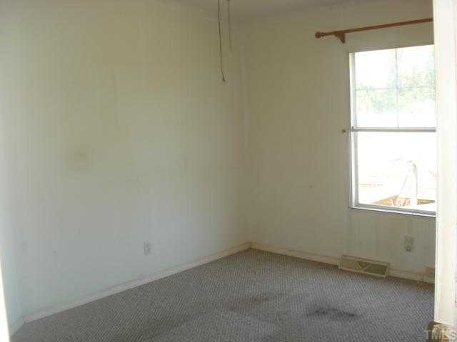 1001 Barnes Road Middlesex, NC 27557 - Photo 8 of 12 an empty room with a window