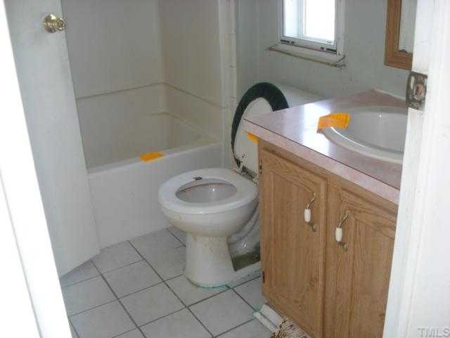 1001 Barnes Road Middlesex, NC 27557 - Photo 9 of 12 a bathroom with a sink and toilet