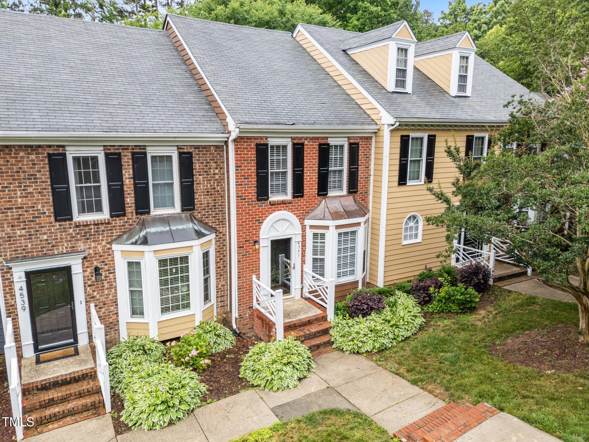 4541 Hershey Court Raleigh, NC 27613 - Photo 2 of 25 a front view of a house with a yard