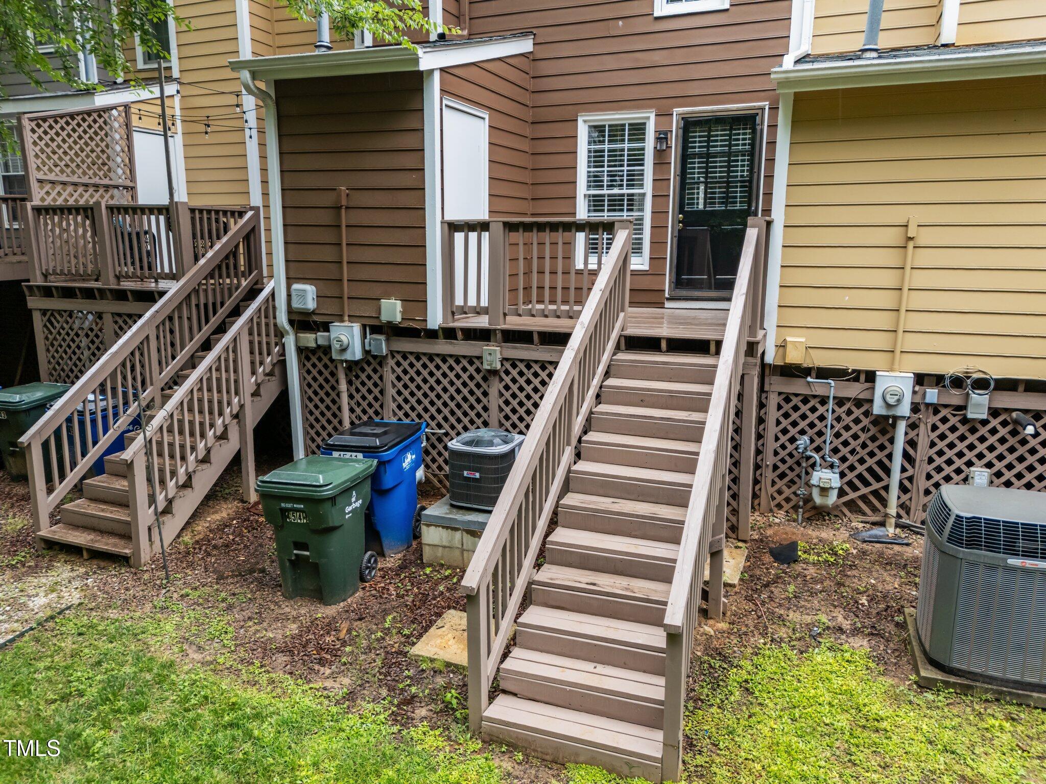 4541 Hershey Court Raleigh, NC 27613 - Photo 21 of 25 a view of a balcony with two chairs and a potted plant