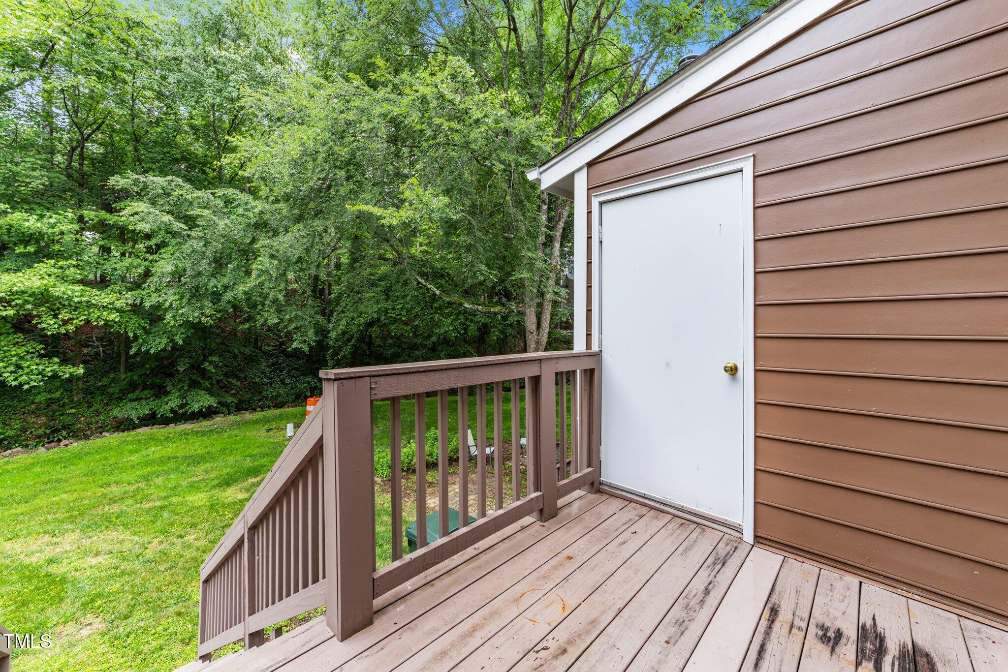 4541 Hershey Court Raleigh, NC 27613 - Photo 22 of 25 a view of backyard with deck and wooden floor