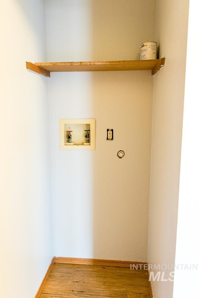 1158 Southwest 14th Avenue Ontario, OR 97914 - Photo 28 of 32 Washroom with hookup for a washing machine and wood finished floors