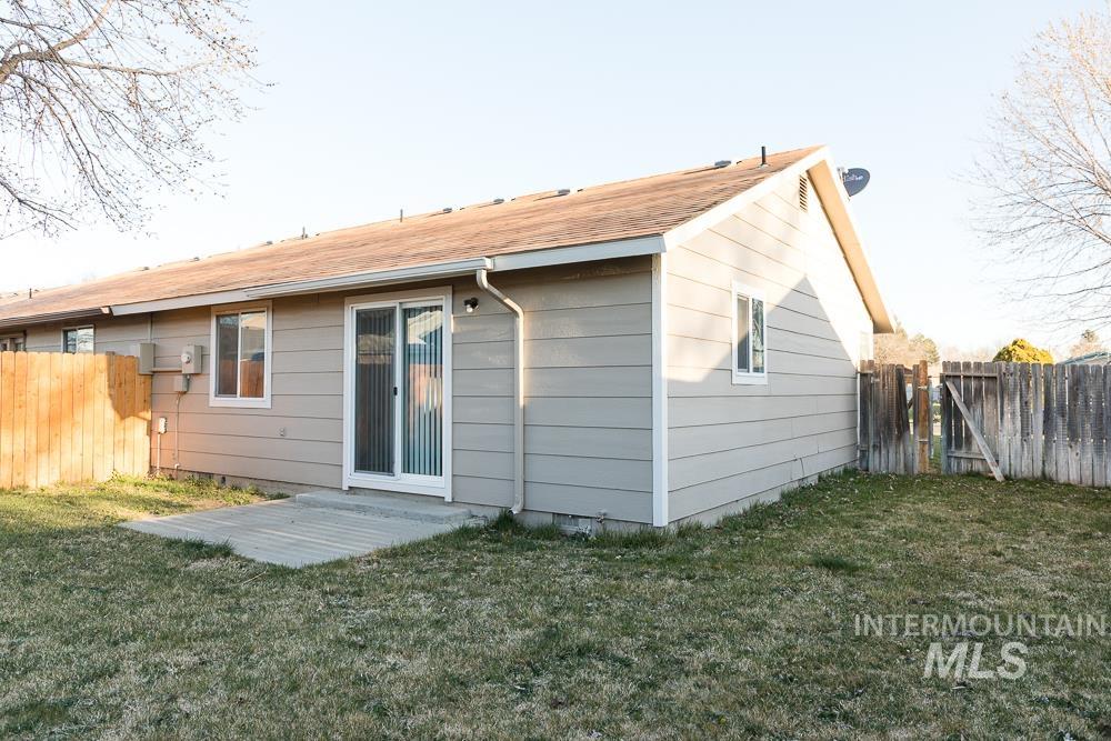 1158 Southwest 14th Avenue Ontario, OR 97914 - Photo 4 of 32 Back of house with a fenced backyard, a patio, and a gate
