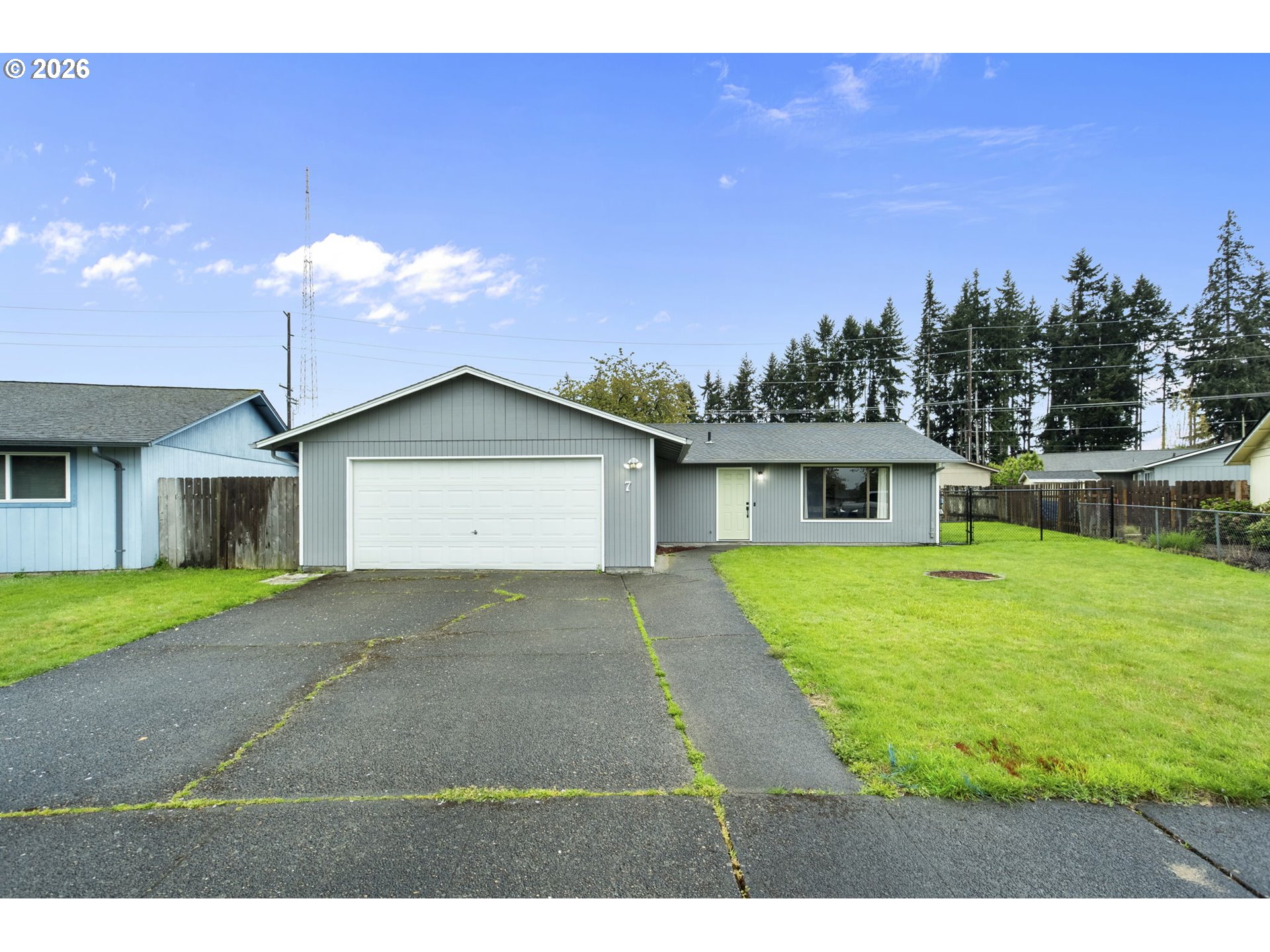 7 Olive Court Longview, WA 98632 - Photo 1 of 35 a front view of a house with a yard and garage