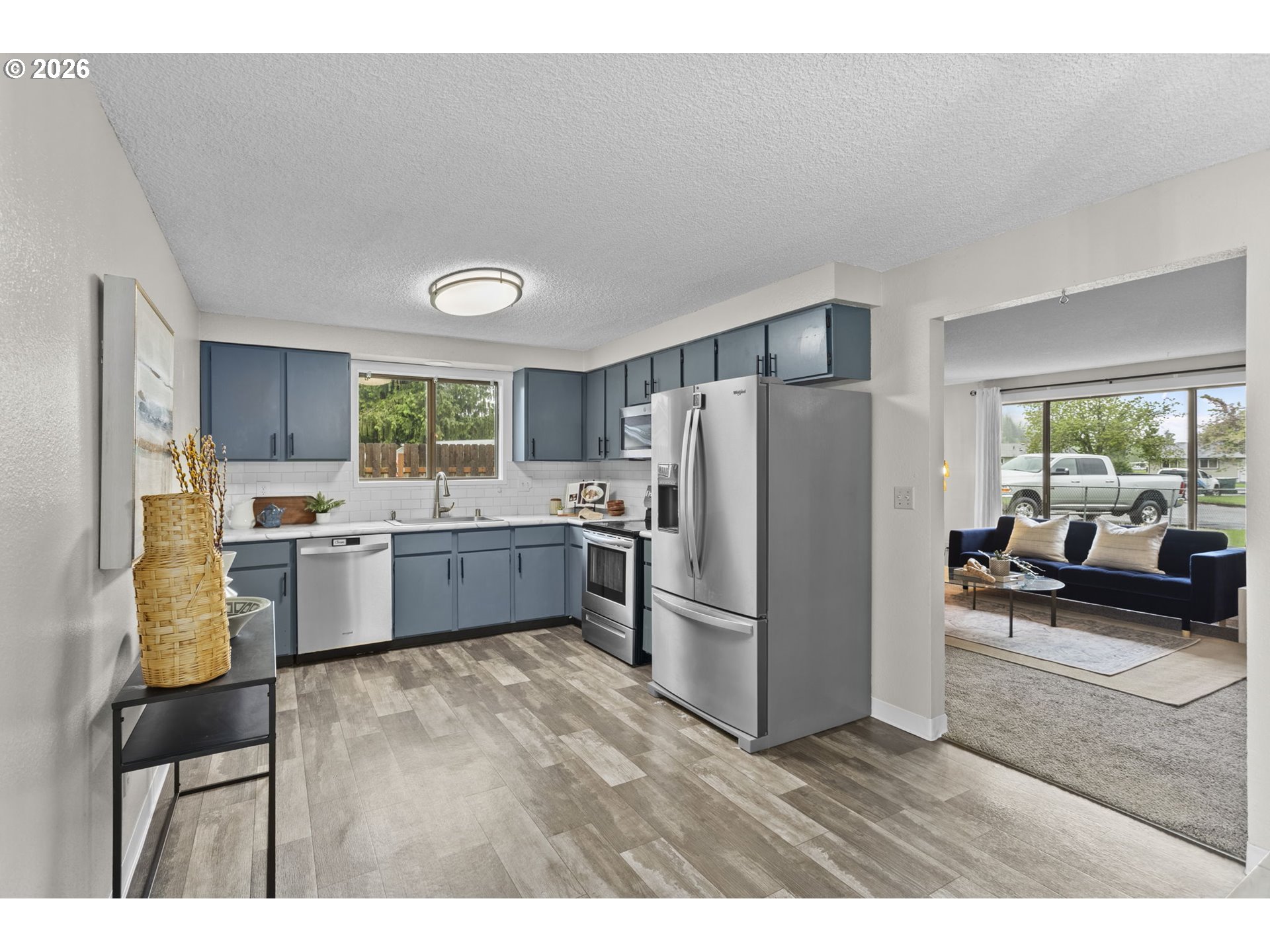 7 Olive Court Longview, WA 98632 - Photo 11 of 35 a kitchen with a refrigerator and a sink