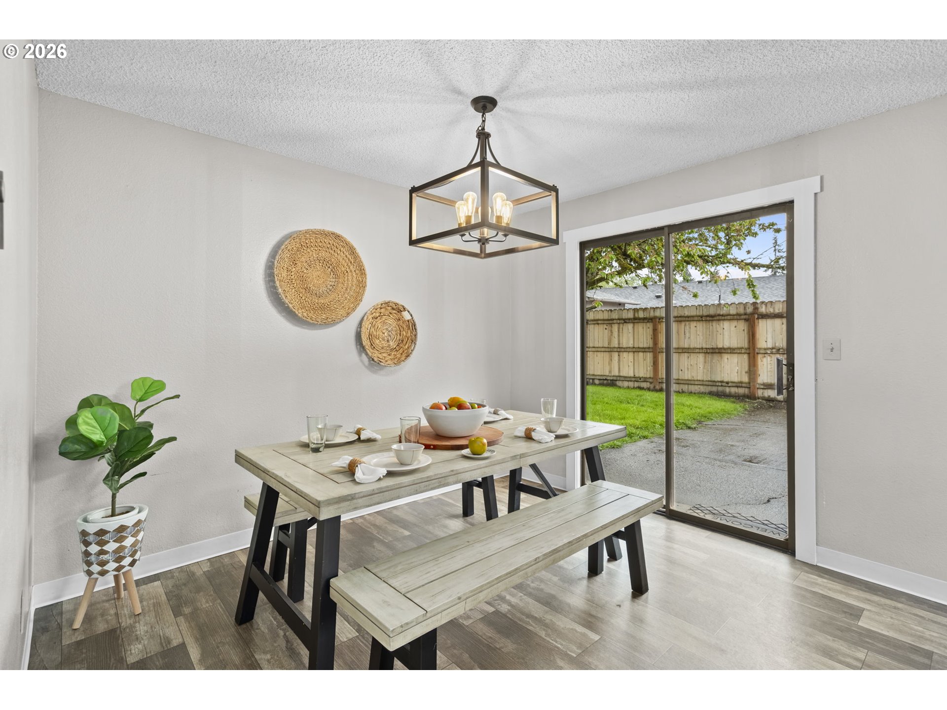 7 Olive Court Longview, WA 98632 - Photo 17 of 35 a dining room with furniture a potted plant and a rug