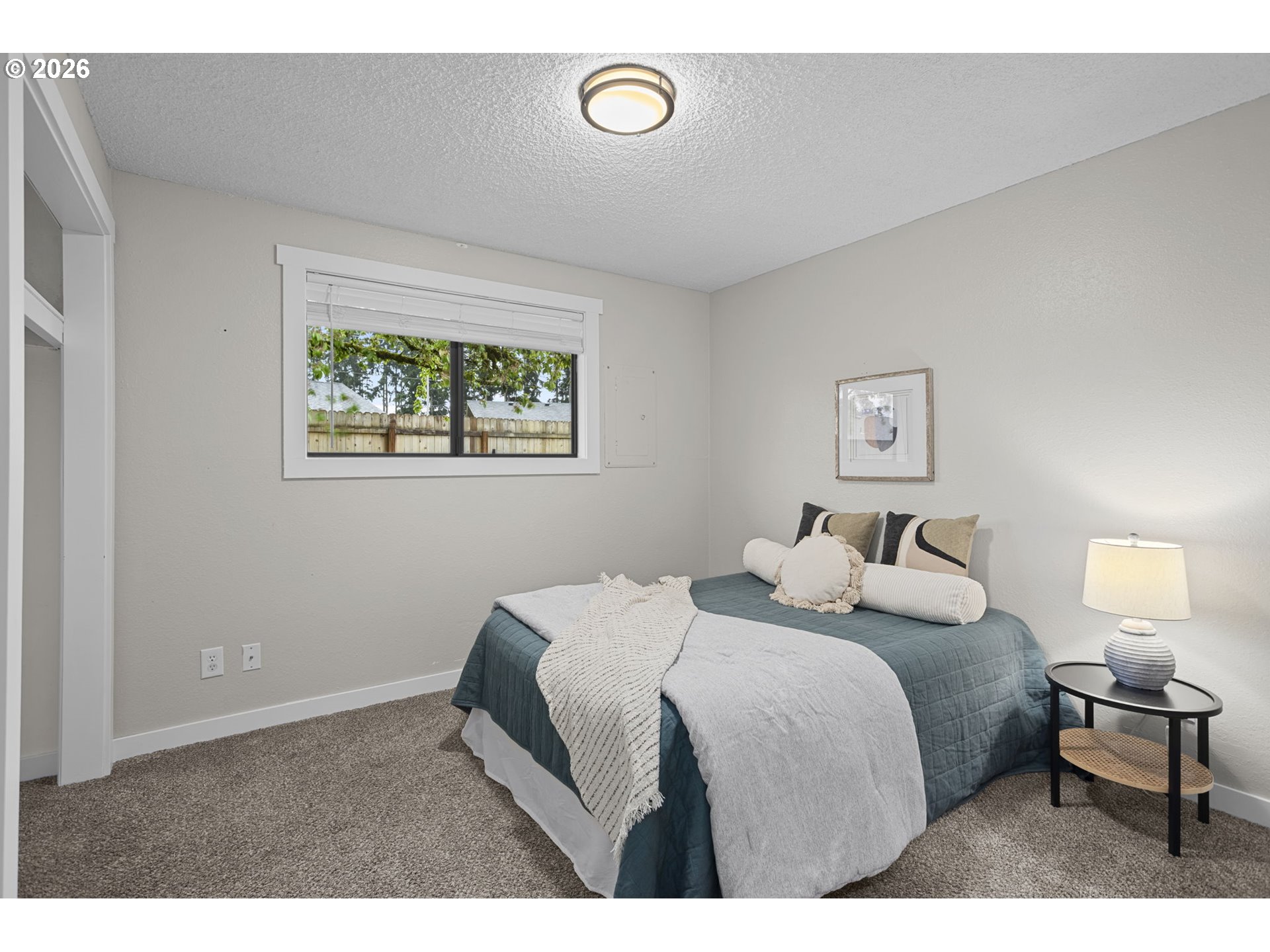 7 Olive Court Longview, WA 98632 - Photo 18 of 35 a bedroom with a bed and a lamp on table
