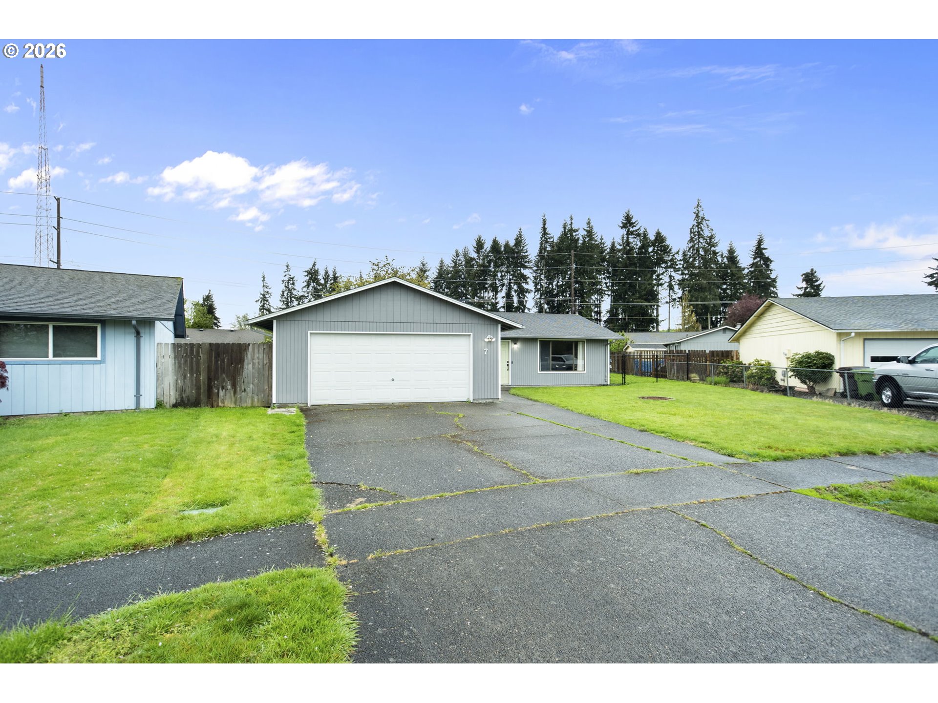 7 Olive Court Longview, WA 98632 - Photo 2 of 35 a view of a house with a yard and a car parked in front of it