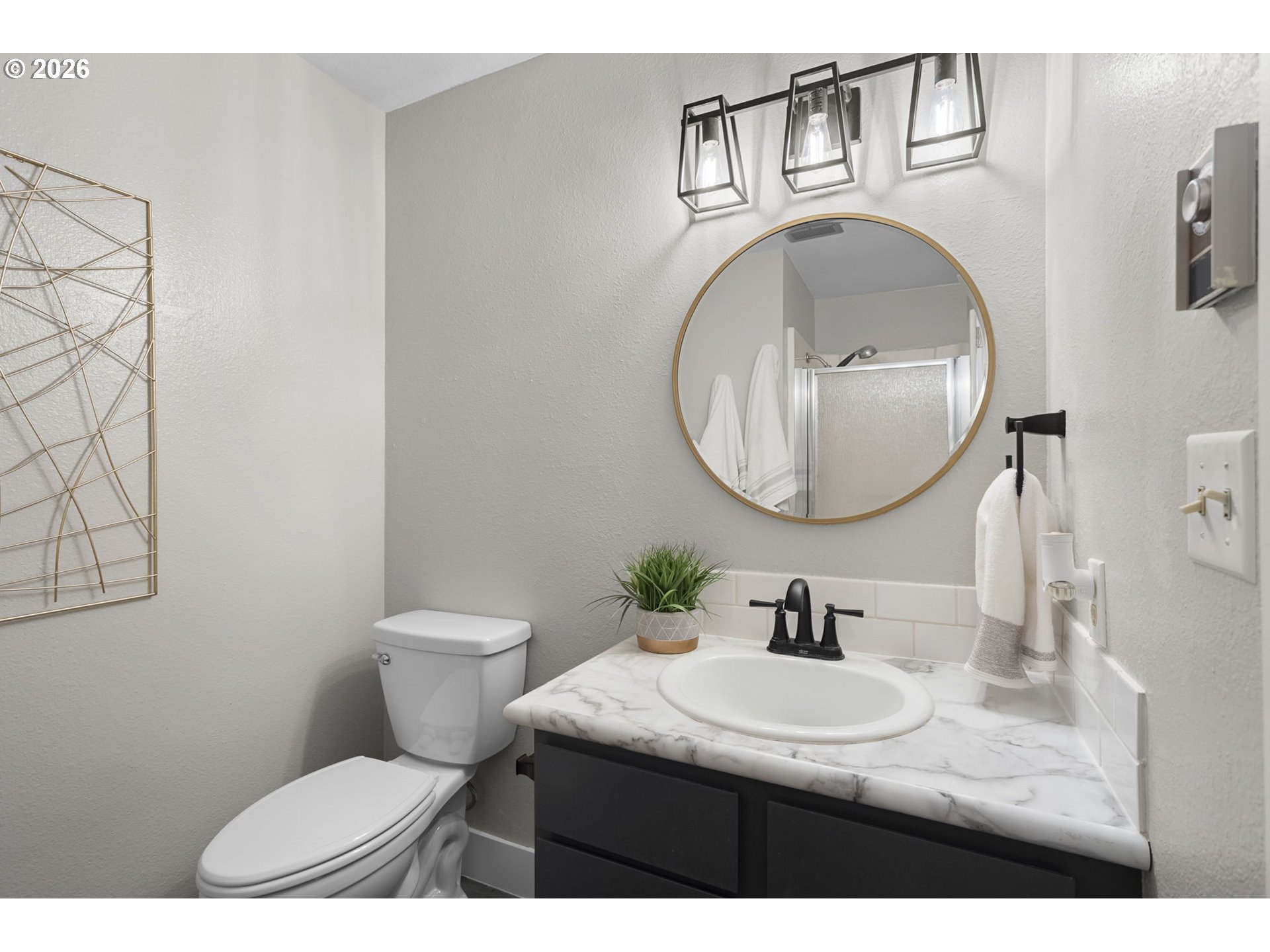 7 Olive Court Longview, WA 98632 - Photo 26 of 35 a bathroom with a sink a mirror and a toilet