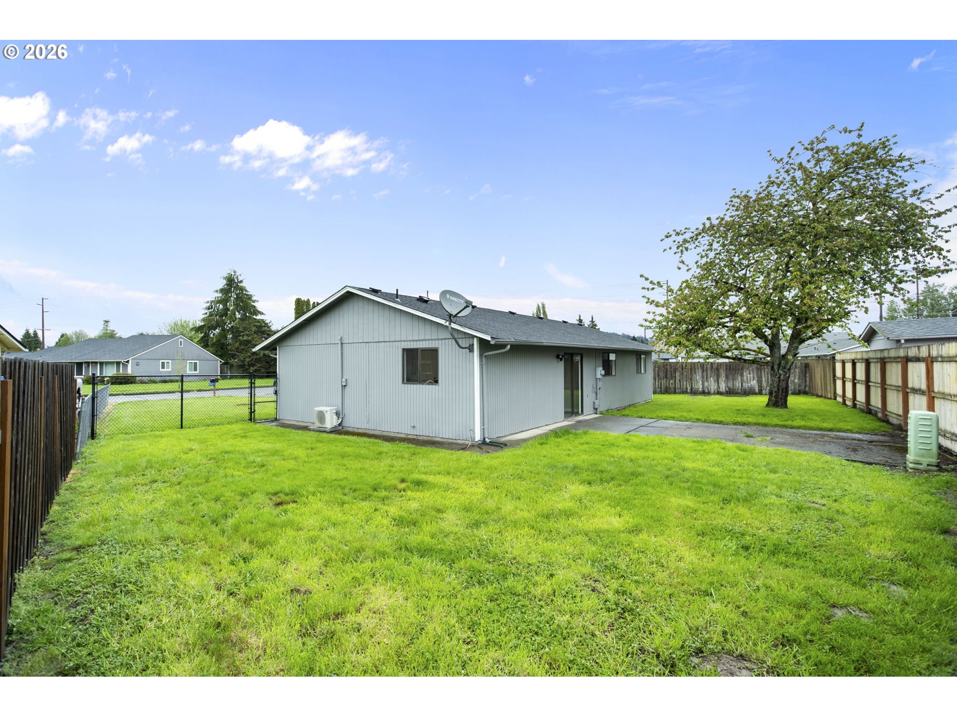 7 Olive Court Longview, WA 98632 - Photo 29 of 35 a house with huge green field in front of it