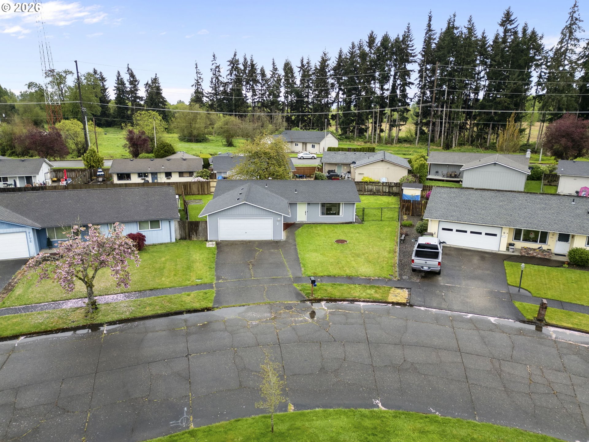 7 Olive Court Longview, WA 98632 - Photo 3 of 35 a view of a swimming pool with a patio and a garden