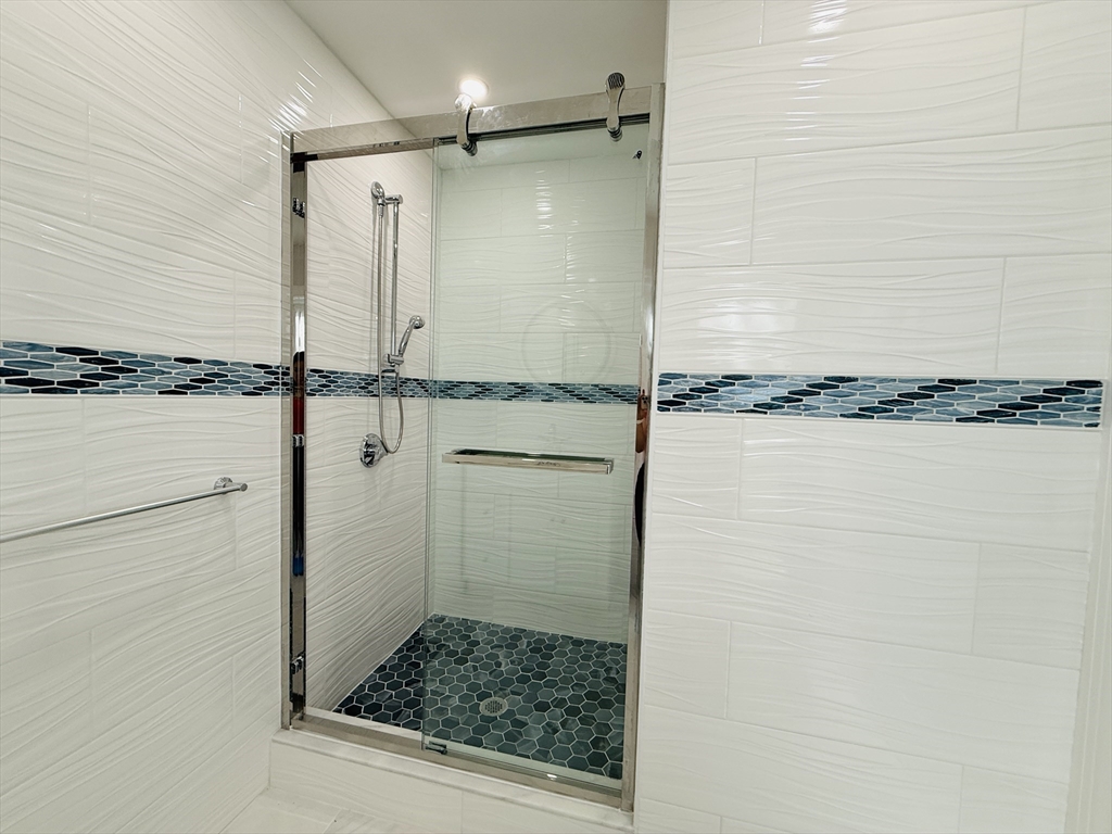4 Baldwin Street, Unit 4 Newton, MA 02458 - Photo 11 of 30 a bathroom with a shower