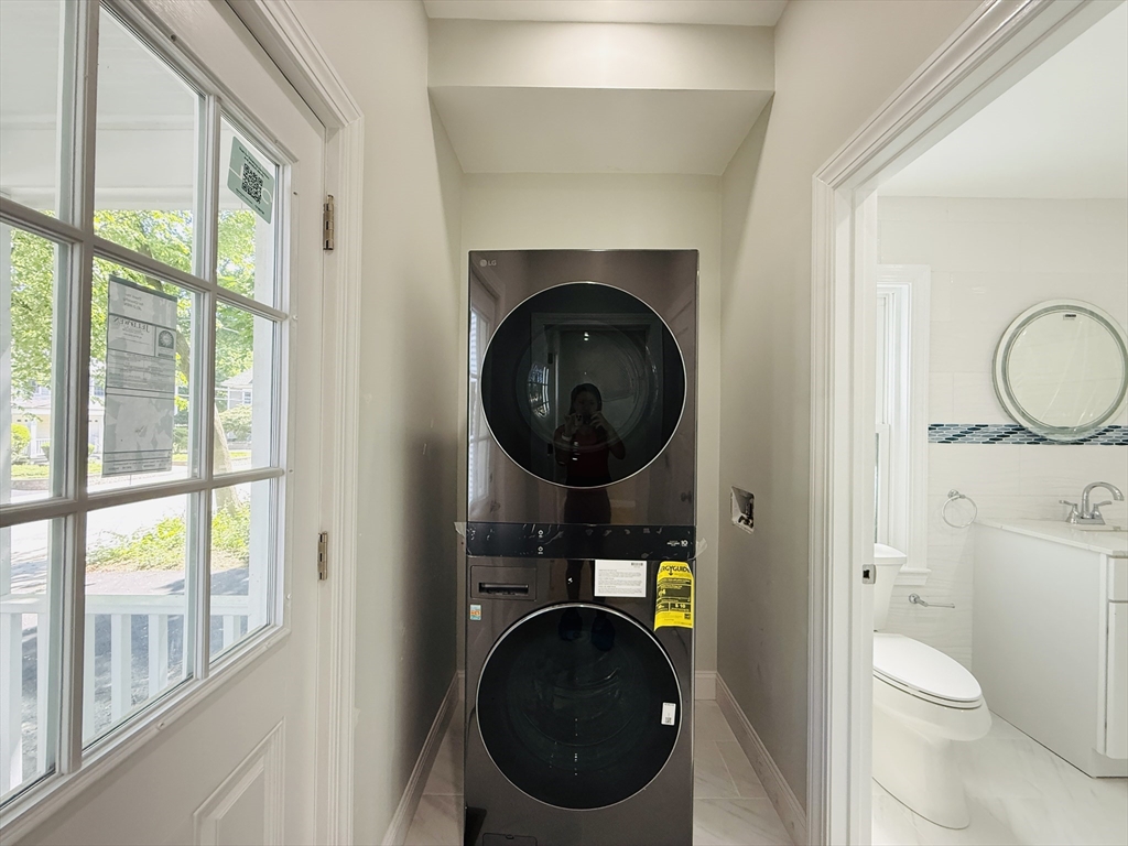 4 Baldwin Street, Unit 4 Newton, MA 02458 - Photo 12 of 30 a bathroom with a toilet a sink and a mirror