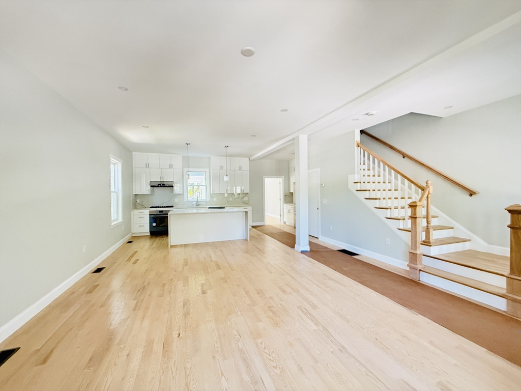 4 Baldwin Street, Unit 4 Newton, MA 02458 - Photo 2 of 30 a view of empty room with wooden floor