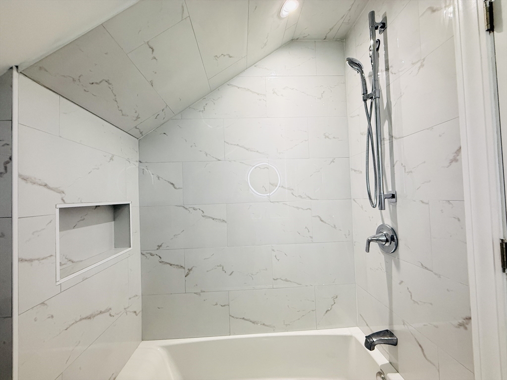 4 Baldwin Street, Unit 4 Newton, MA 02458 - Photo 24 of 30 a bathroom with a bathtub