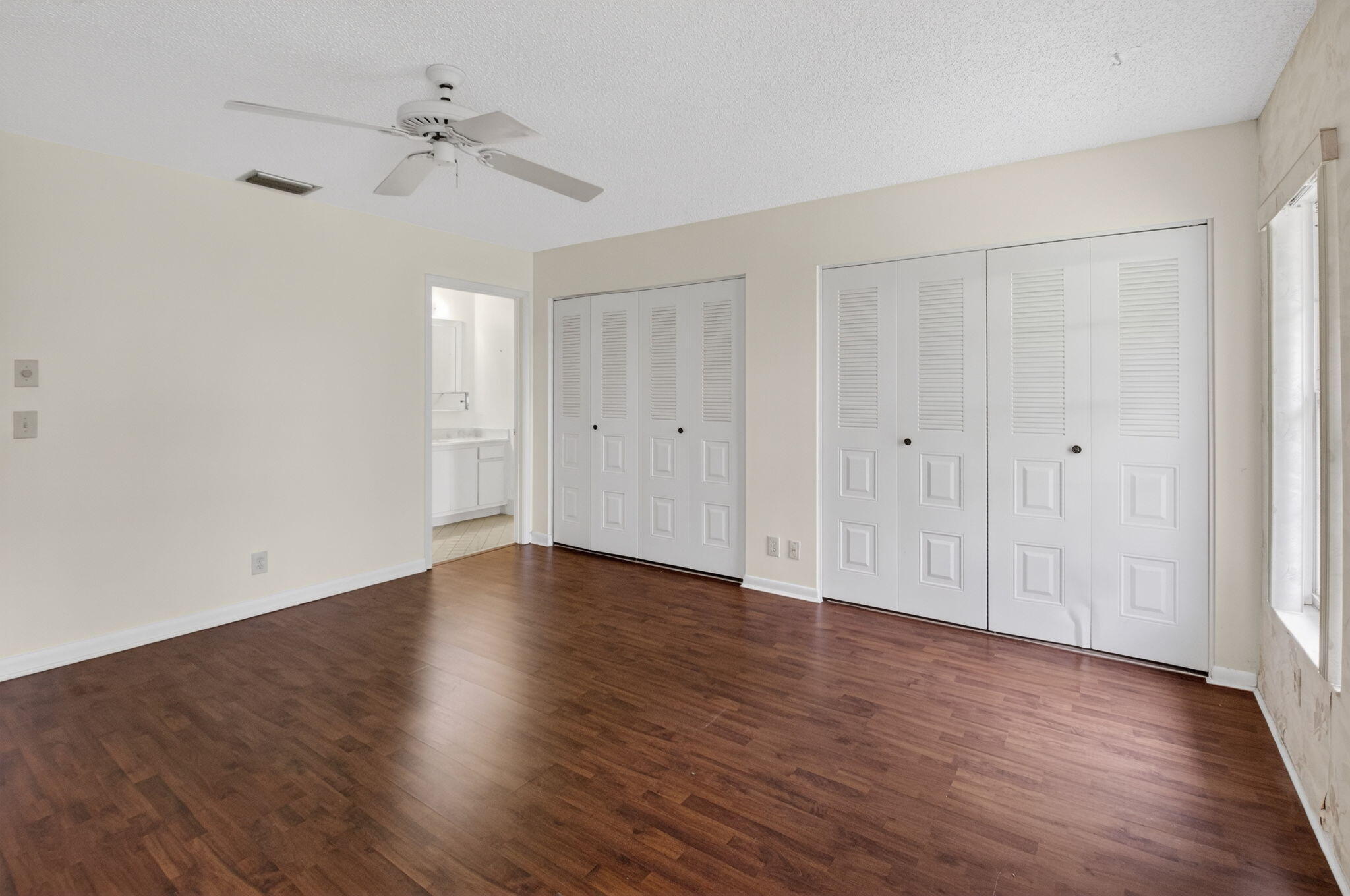 6321 Lasalle Road Delray Beach, FL 33484 - Photo 14 of 38 a view of an empty room with wooden floor