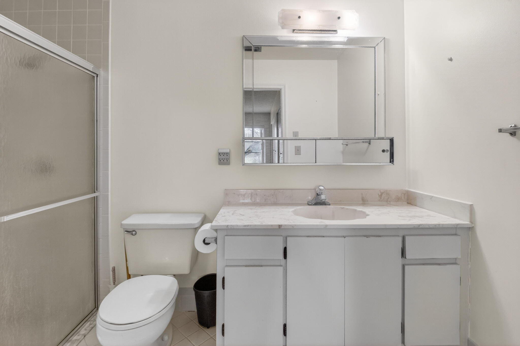 6321 Lasalle Road Delray Beach, FL 33484 - Photo 15 of 38 a bathroom with a sink a toilet and mirror