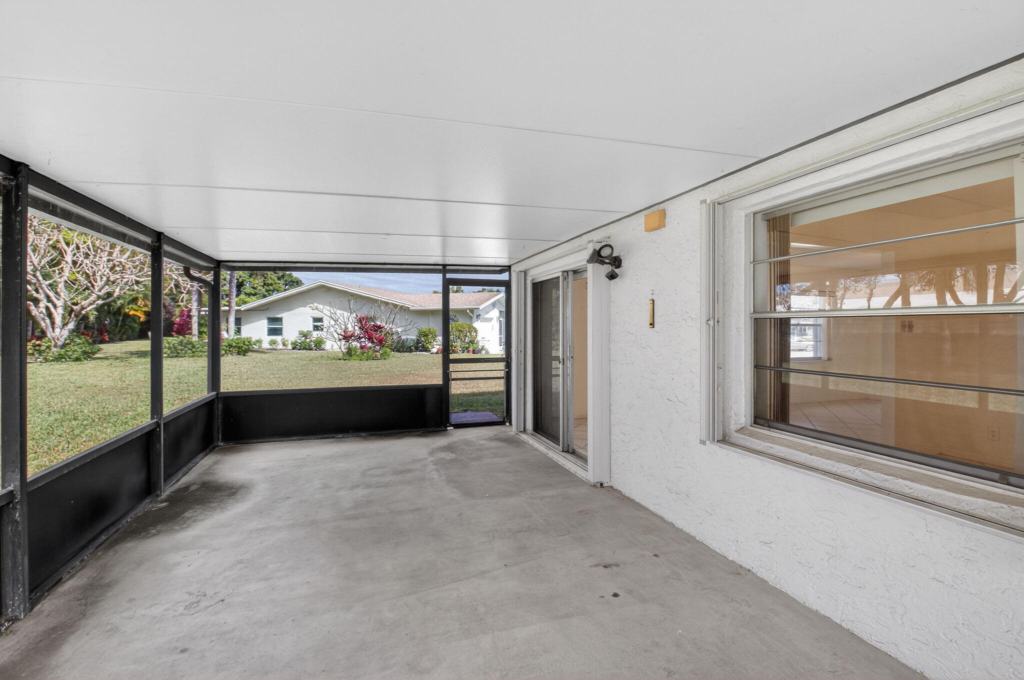 6321 Lasalle Road Delray Beach, FL 33484 - Photo 18 of 38 a view of front door with outdoor space