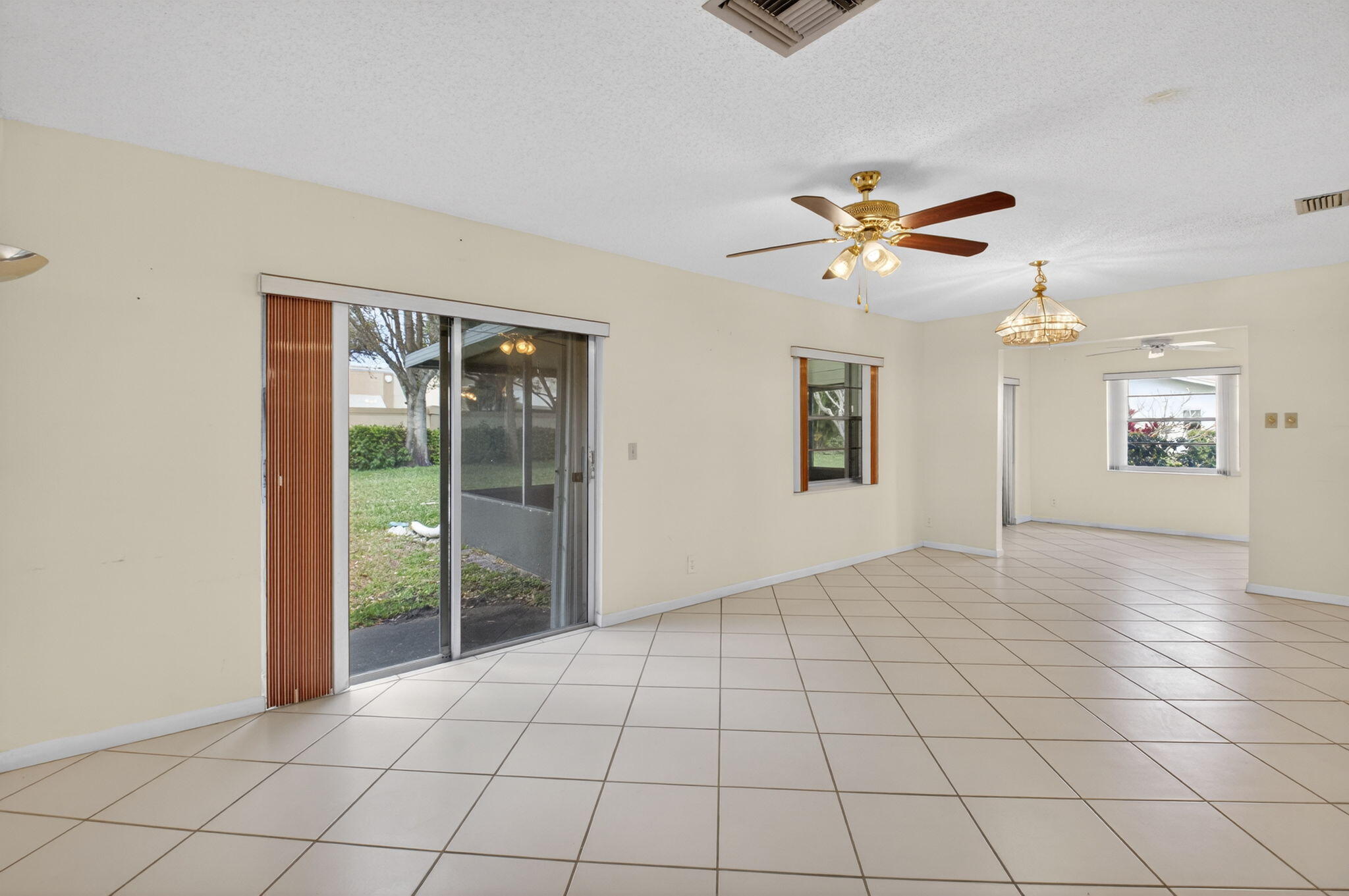 6321 Lasalle Road Delray Beach, FL 33484 - Photo 5 of 38 a view of an empty room and a ceiling fan window