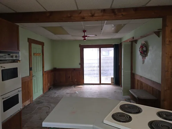 a view of a livingroom with furniture and a window